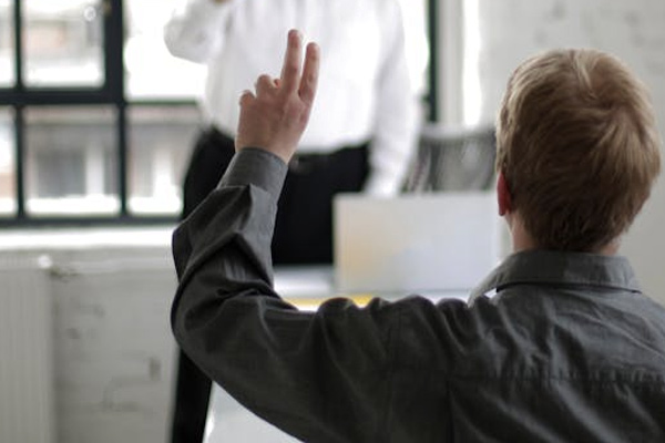 People Having a Discussion in a White Room