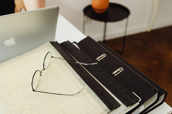 Photograph of Eglasses on Top of Binders