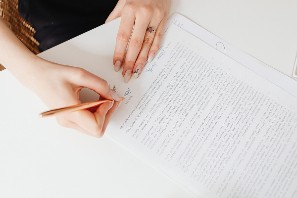 person-writing-on-white-paper
